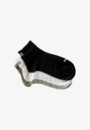 Three pairs of ankle socks in black, white, and gray. Made of cotton blend with ribbed cuffs and logo detail near the tops.