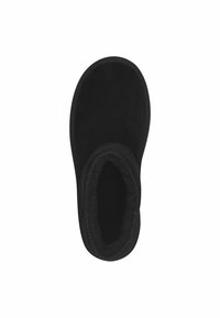 Chausson noir avec un intérieur doux et moelleux, forme arrondie et détails cousus le long des bords. Fabriqué en matériau semblable à du daim.