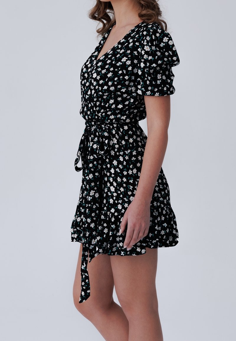 black dress with small white flowers Wild Flower Flared Satin Mini Dress main image 0