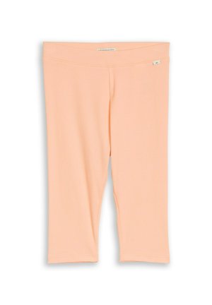 Pfirsichfarbene, gerippte Leggings bis zum Knie mit elastischem Bund, aus Bio-Baumwolle, flach auf weißem Hintergrund dargestellt.