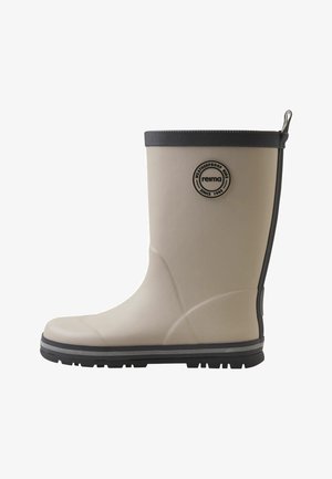 Botte de pluie en caoutchouc beige pour enfant, avec semelle noire, bordure noire et logo circulaire « reima » sur le côté.