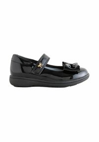 Chaussure Mary Jane en cuir verni noir avec une bride Velcro, un détail décoratif doré et un nœud sur le bout arrondi.