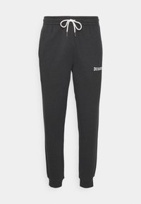 Grijze sweatpants van een katoenen mengsel, met een elastische tailleband met trekkoord en geribde boorden. Inclusief geborduurd "DC Shoes" logo.