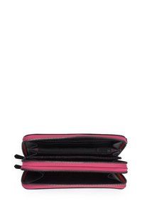 Zip-around wallet in black with fuchsia accents; features multiple compartments, card slots, and two zippered sections. Textured interior.