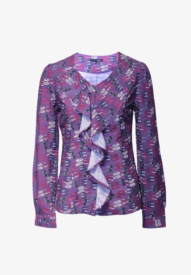 Blusa de manga larga morada con un frente con volantes, que presenta un patrón de formas ovaladas y puntos coloridos en tonos rojos, blancos y verdes.