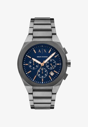 Reloj de acero inoxidable con esfera azul, acentos en oro rosado, caja sobredimensionada, funciones de cronógrafo y display de fecha a las 6 en punto.