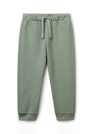 Pantaloni da tuta verde chiaro con vita elastica, coulisse, tasche laterali e polsini a coste su sfondo bianco.
