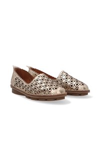 Metallic gold slip-on shoes featuring a laser-cut floral design, brown rubber sole, and tan interior lining.
