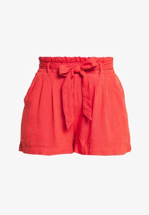 Shorts rojos de lino con cintura alta elástica, detalle de lazo frontal y bolsillos laterales. Textura suave y diseño plisado.