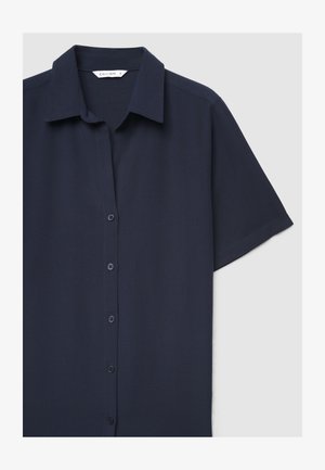 Camicia blu navy a maniche corte con bottoni, colletto e tessuto liscio.