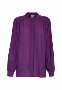 Blusa lunga viola a maniche lunghe realizzata in tessuto leggero. Presenta un collo alto e maniche arricciate per un fit comodo. Nessuna chiusura visibile.