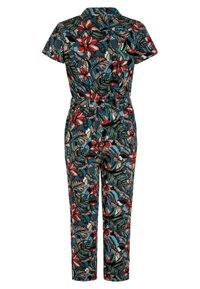 Floral jumpsuit featuring short sleeves, a collar, and a belted waist. The fabric has a vibrant pattern of red flowers and green leaves.