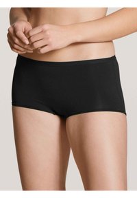 Shorts hipster in cotone nero con una superficie liscia, cintura elastica e taglio aderente, progettati per il comfort e l'uso quotidiano.