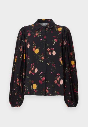 Blusa nera a maniche lunghe con motivo floreale in rosa, giallo e rosso, maniche a sbuffo e colletto a punta, con chiusura a bottoni.