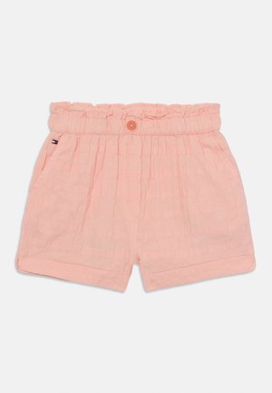 Peene värvi lühikesed püksid, mis on valmistatud tekstureeritud kangast. Omavad elastset vööd ja nööbiga kinnitust. Sisaldavad kaht küljetaskut.