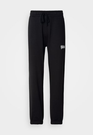 Svarta sweatpants i mjukt tyg, med resårmidja och justerbara dragsko, samt en liten broderad logo på sidan.