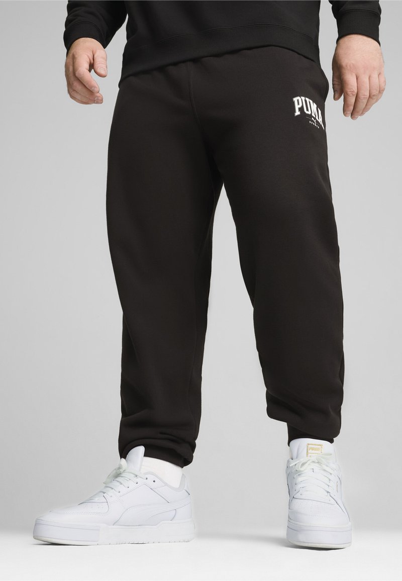 Puma SQUAD JOGGING - Teplákové kalhoty - black
