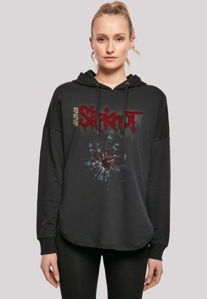 Black hoodie with a graphic design featuring the text "Slipknot" in red, alongside a splatter pattern. Features a relaxed fit and drawstrings.
