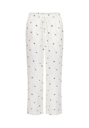 Witte pyjamabroek met elastische tailleband en trekkoord, voorzien van een patroon van kleine groene bladeren en rode stippen over de stof.