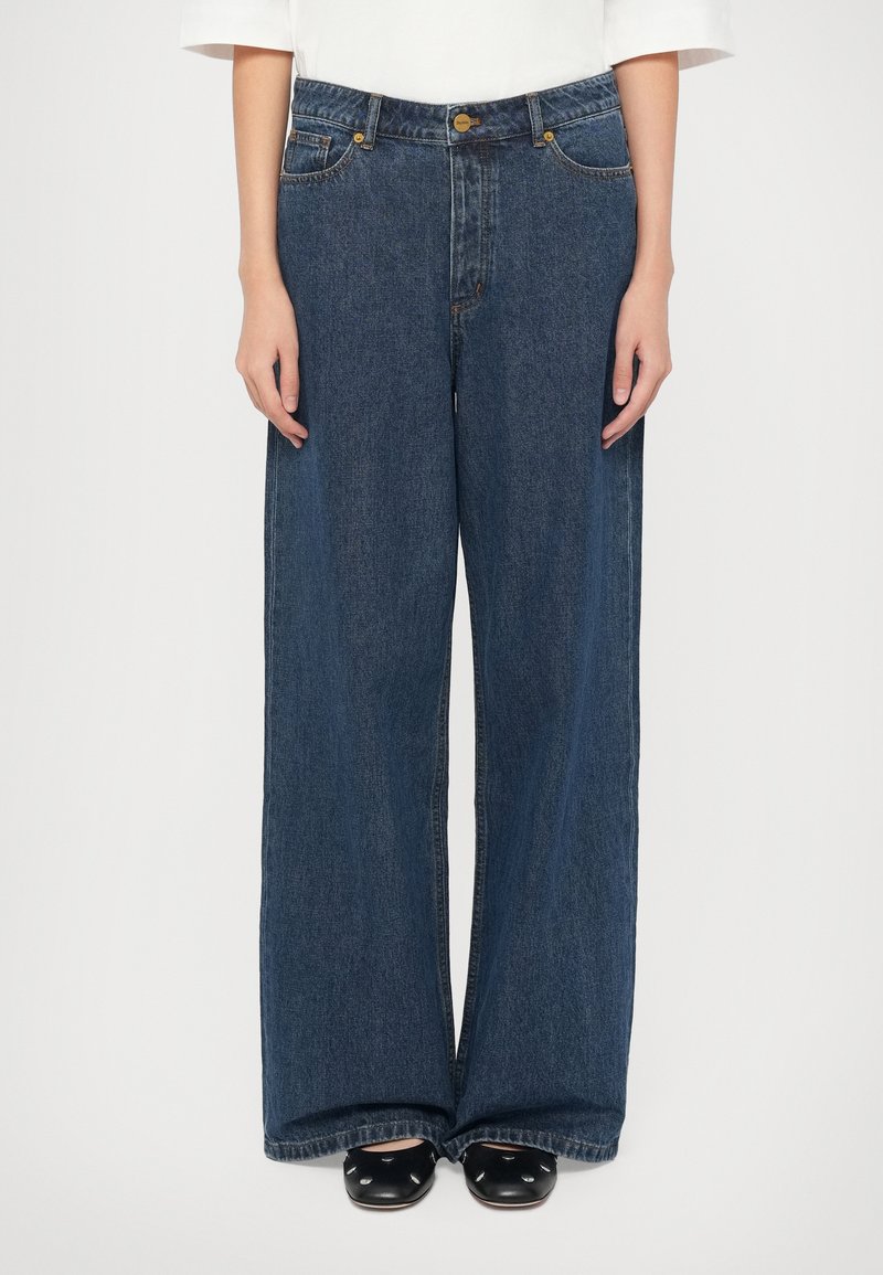 Bredde ben, mørkeblå denimjeans med høy midje, med frontlommer, særpreget søm og knappelukking.