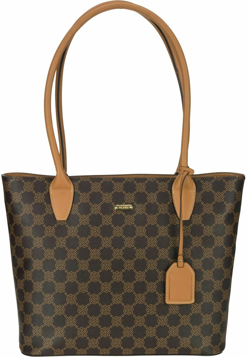 Brown patterned tote bag with tan leather accents and handles. Features a rectangular shape and a small tag attached. Gold brand logo visible.
