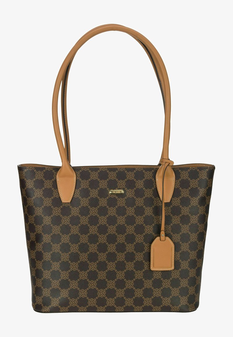 Brown patterned tote bag with tan leather accents and handles. Features a rectangular shape and a small tag attached. Gold brand logo visible.