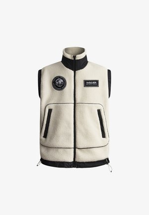 Kremkrāsas vilnas veste ar melniem akcentiem, ar priekšējo rāvējslēdzēju, divām kabatām un uzlīmēm uz krūšu zonas. Projektēta ar augstu apkakli un mīkstāku faktūru.
