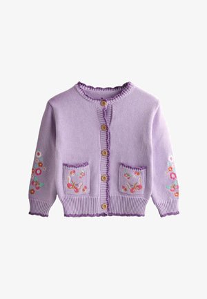 Lilakate värvi kootud kardigan puidust nööpidega, lille- ja liblikapitsidega taskutel ja varrukatel ning soonikkoes ääred.