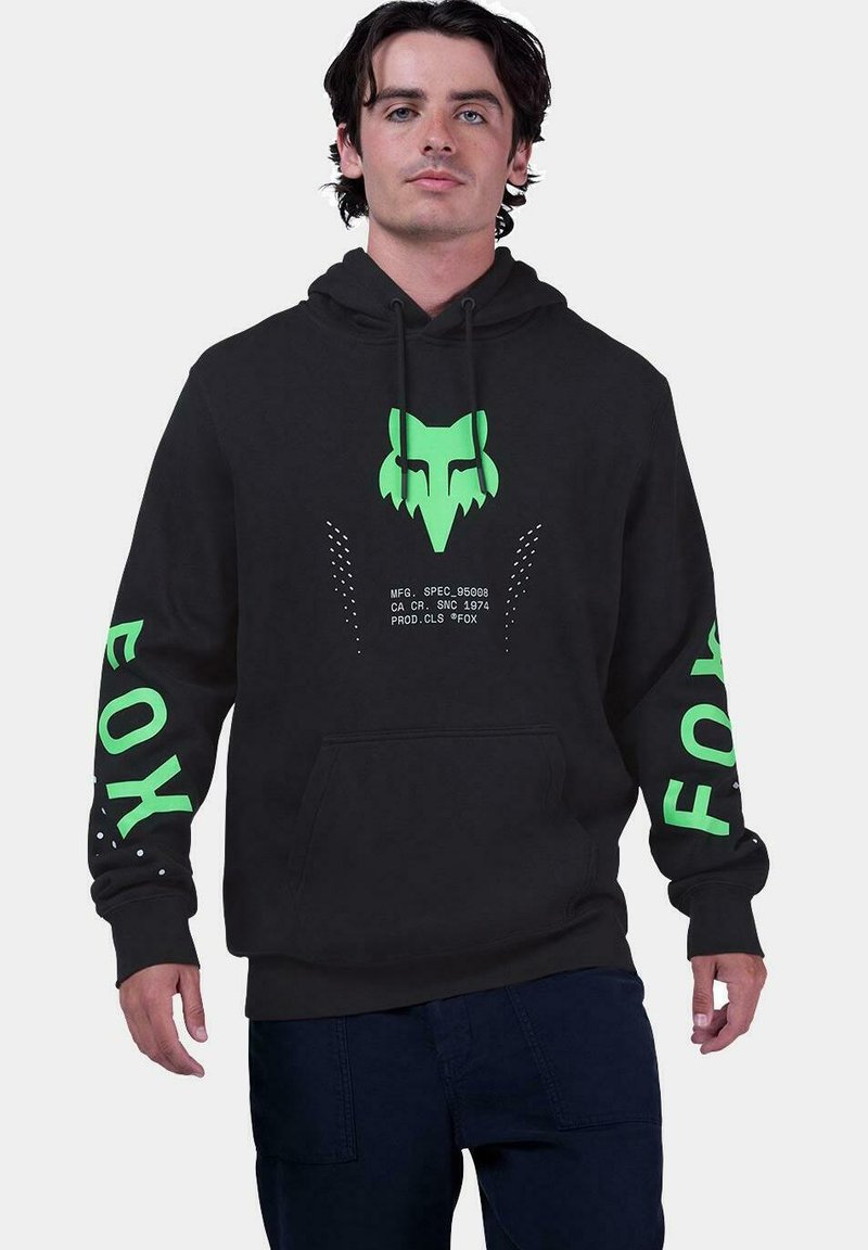 Sudadera negra con un gráfico de un zorro verde en el frente, texto verde en las mangas y acentos de puntos. Hecha de una tela suave con un bolsillo en la parte frontal.