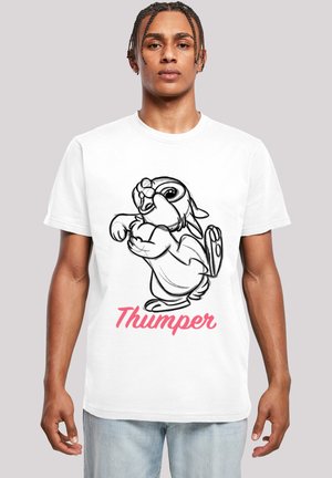 White cotton t-shirt with black line-drawn rabbit character Thumper and pink text below. Model wears relaxed fit, crew neck style.
