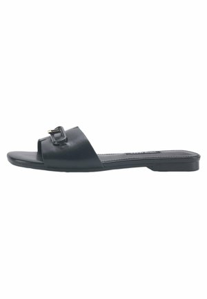 Black leather slide sandal featuring a wide strap with a rectangular buckle accent, flat sole, and minimalist design.