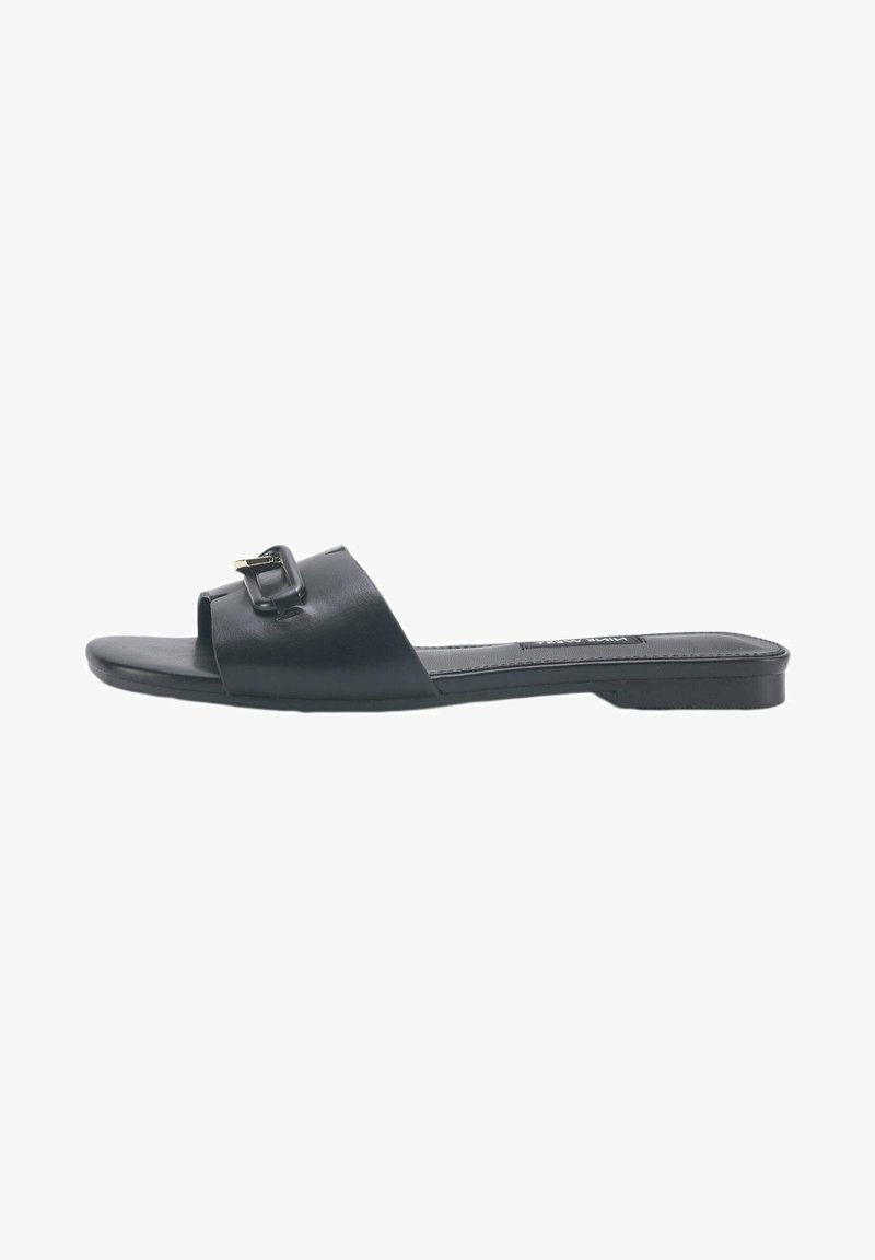 Black leather slide sandal featuring a wide strap with a rectangular buckle accent, flat sole, and minimalist design.