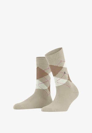 Beige socks featuring an argyle pattern in brown, white, and pink. Ribbed cuff, reinforced toe, and heel. Soft knit material.