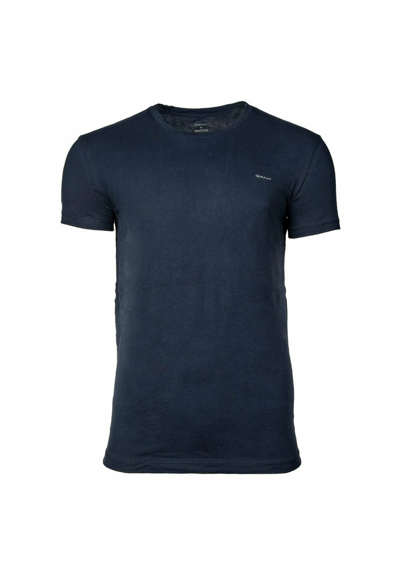 T-shirt blu navy scuro a maniche corte con scollo rotondo e piccolo logo "GANT" sul petto sinistro, mostrata su sfondo bianco semplice.