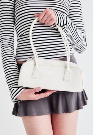 White crocodile-embossed handbag with two handles, rectangular shape, and zipper closure. Displayed against a light background.