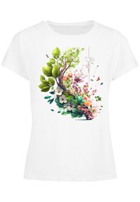 White cotton T-shirt featuring a colorful floral and tree graphic with green leaves, pink flowers, and butterflies, labeled "Blossom."