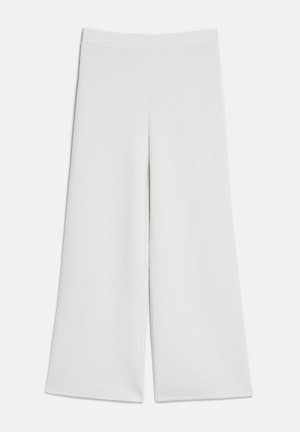 Pantalon blanc à jambes larges avec taille haute et sans attaches visibles, présenté à plat sur un fond clair.