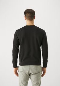 Champion ICONS CREWNECK SMALL LOGO - Felpa - black