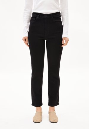 Svarta högmidjade jeans i slim fit, tillverkade av bomullsdenim, med fem fickor och rå kant vid ankeln.
