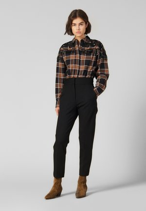 NALLA - Trousers - black