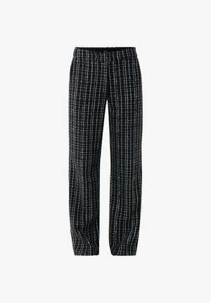 Sorte og hvide mønstrede bukser med en løs pasform, der har et struktureret stof og en elastisk talje. Bukserne har lige ben.