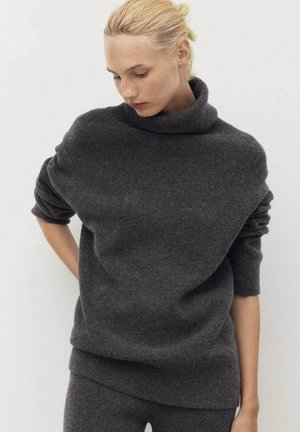 Dark gray, oversized sweater with a high, rolled neckline and loose-fitting sleeves. Made of soft, textured knit material.