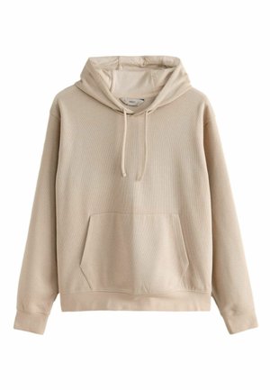 Beige hooded sweatshirt in a ribbed texture with a front pocket and drawstring. Features long sleeves and a relaxed fit.