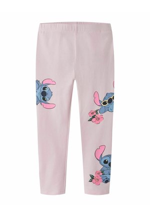 Jasnoróżowe legginsy z wieloma niebieskimi postaciami z kreskówek przypominającymi Stitcha, niektóre trzymają lub są blisko różowych kwiatów, jedna ma na sobie okulary przeciwsłoneczne.