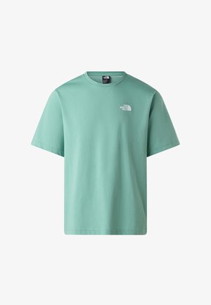 Camiseta de algodón verde menta con mangas cortas y cuello redondo. Presenta un pequeño logotipo blanco en la parte superior izquierda del pecho.