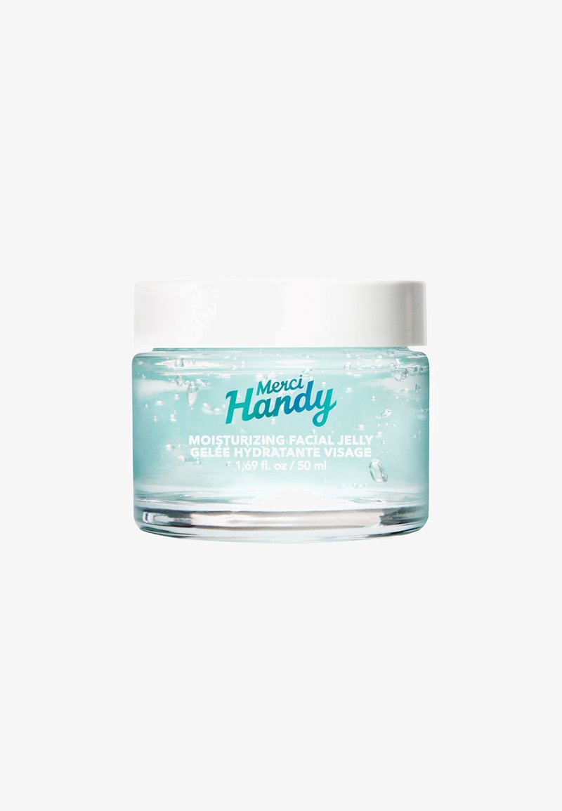 Klares Glasgefäß mit blauer feuchtigkeitsspendender Gesichtsgelée und weißem Deckel, beschriftet mit "Merci Handy", 50 ml Volumen auf dem Behälter sichtbar.