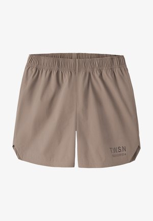Shorts à taille élastique marron clair avec petit texte noir "T.W.S.N" et chiffres sur la jambe inférieure droite, design uni, sans poches visibles.