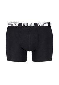 Schwarze Boxer-Shorts mit einem breiten elastischen Bund, auf dem das "PUMA"-Logo in Weiß aufgedruckt ist. Hergestellt aus einem glatten, dehnbaren Stoff.