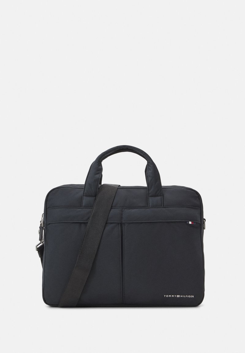 Black nylon laptop bag with dual top handles and adjustable detachable strap. Features front pockets and embroidered logo detail.