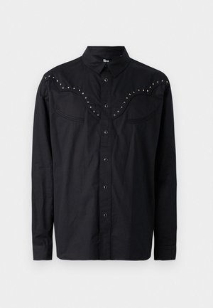 Black button-up shirt made of a smooth fabric, featuring a western-style yoke with metallic studs, two chest pockets, and long sleeves.